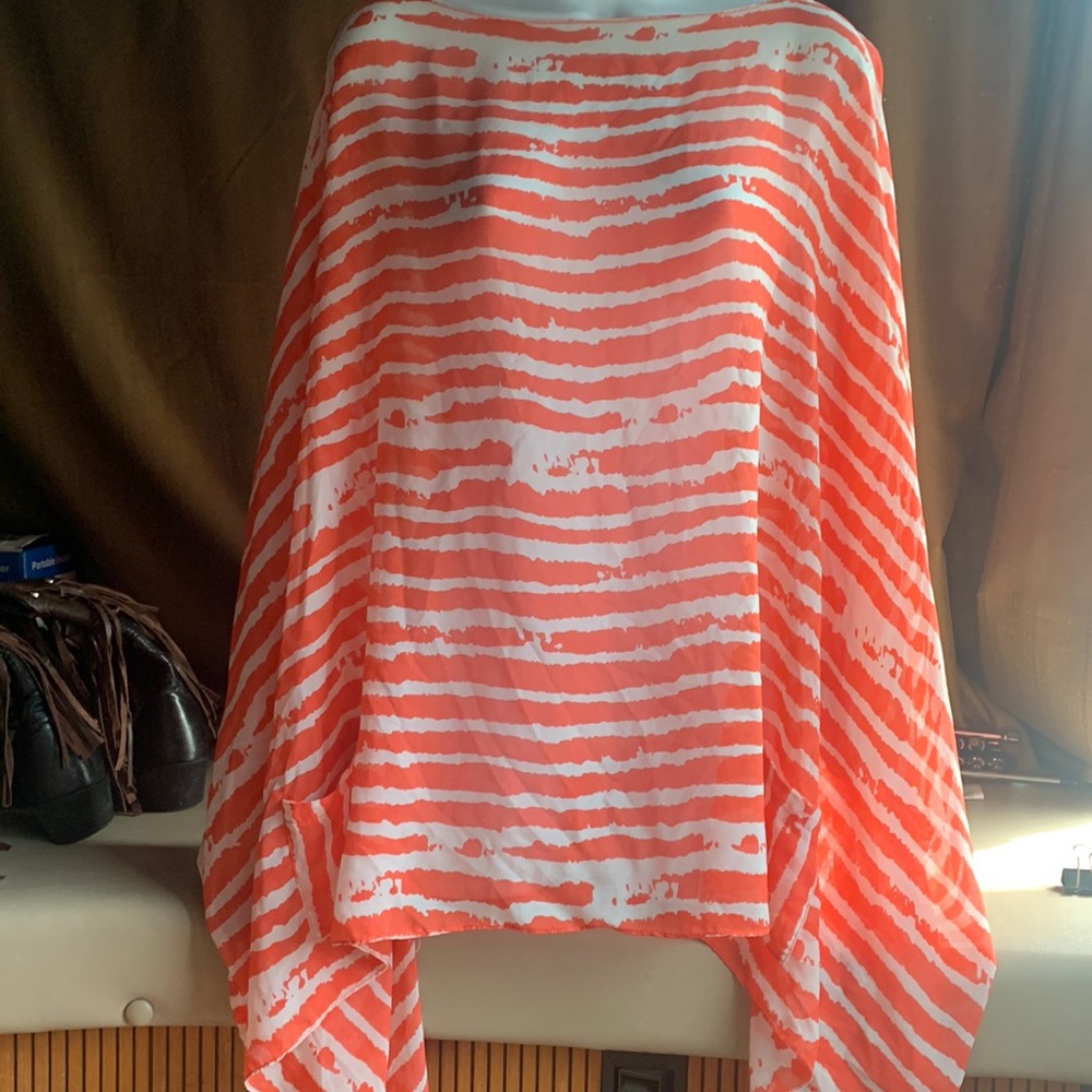 Sheer women’s poncho top. Orange and white zebra pattern in a flowy style